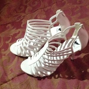Shiek white strapped zip up high heels. Size 10.