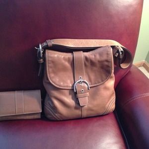 Coach brown leather purse and matching wallet.
