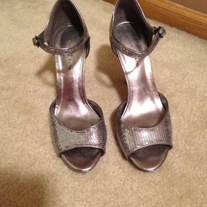 Silver sequined high heels.