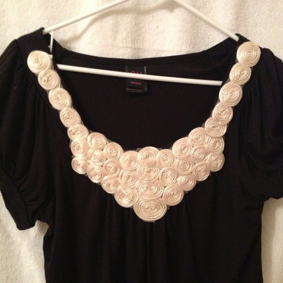 Women's black soft tee with rose embellishments