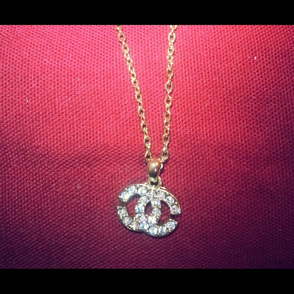 Chanel gold necklace with gold/rhinestone pendant
