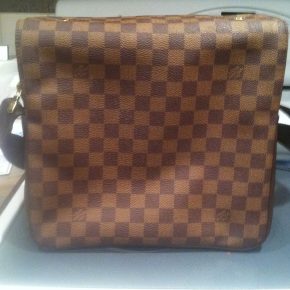Genuine Louis Vuitton cross body purse.