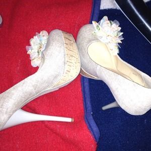 Taupe pumps with flower.