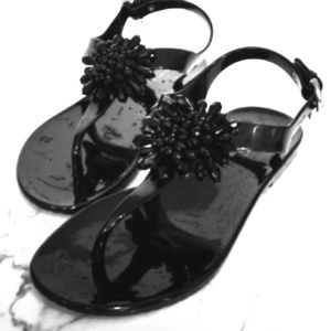 Coach black tstrap with silver charm w/ coach logo