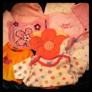 All new, Beanies & Bibs and 4 onesies.