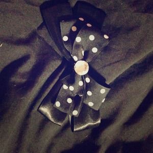 Large black hair bow with white polka dots