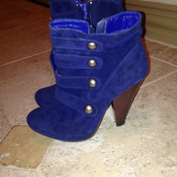Blue boots with silver buttons