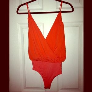 Sexy orange leotard.