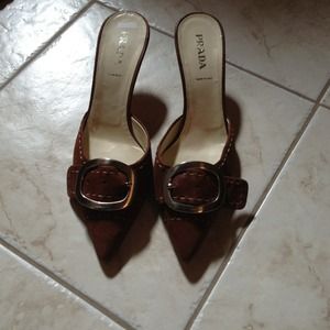 SOLD Brown buckle Prada mules.