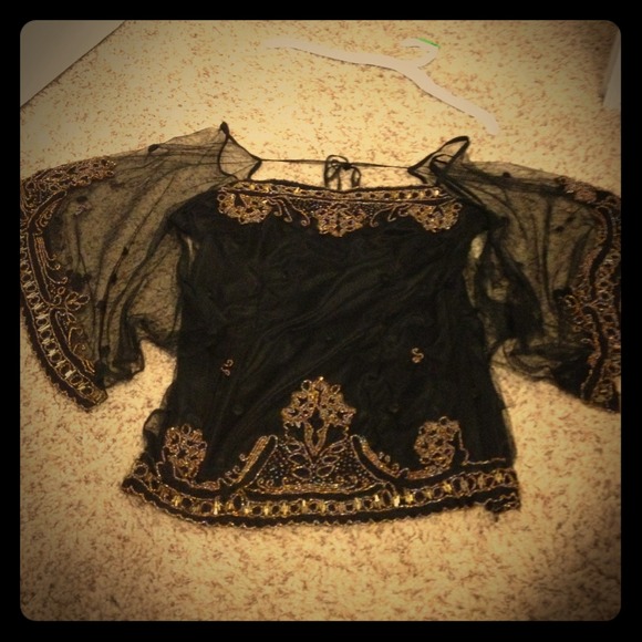 black shirt, see-through sleeves, gold-beaded