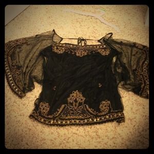 black shirt, see-through sleeves, gold-beaded