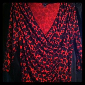 Red and black faux wrap long sleeve top.