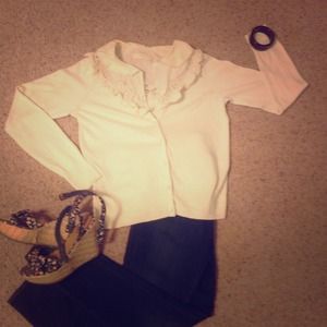 Anthropologie sweater with ruffled collar.