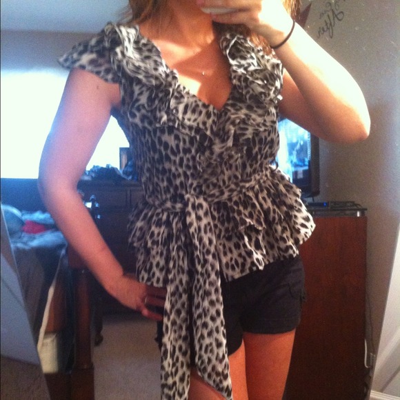 **SOLD** Animal print peplum like top!!