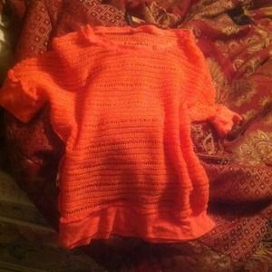 A mesh coral top banded at bottom.  Very stylish