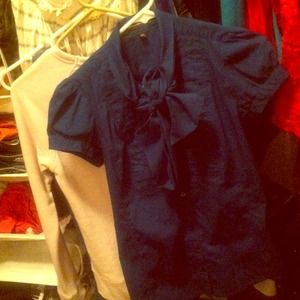 Collared poplin style top.  PleatedButton down