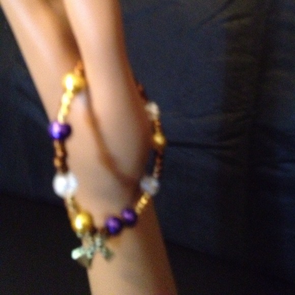 Colt tone bracelet with charm