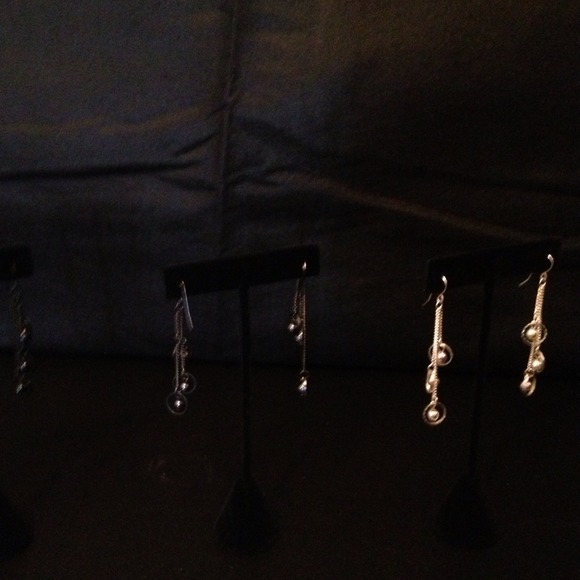 silver dangle earrings and black dangle earring