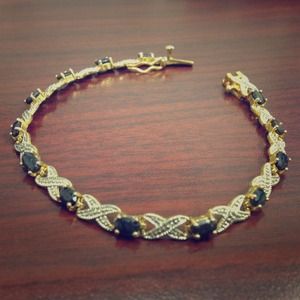 Gold and dark gem stone bracelet