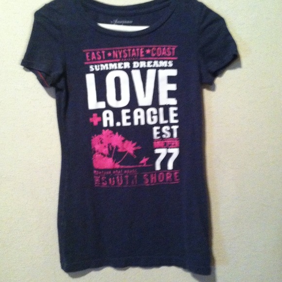 Navy blue shirt with pink and white writing