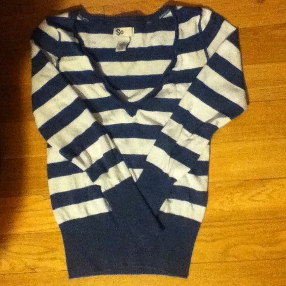 White and blue long sleeved shirt.