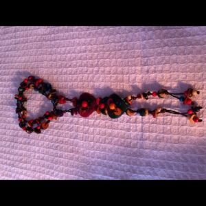 Long colorful necklace made of coconut shell