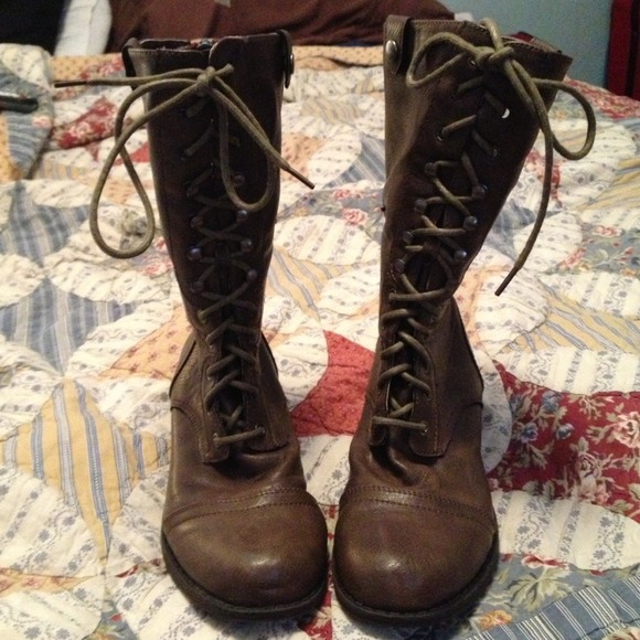 Plaid Flannel lined lace up boots zip up the back.