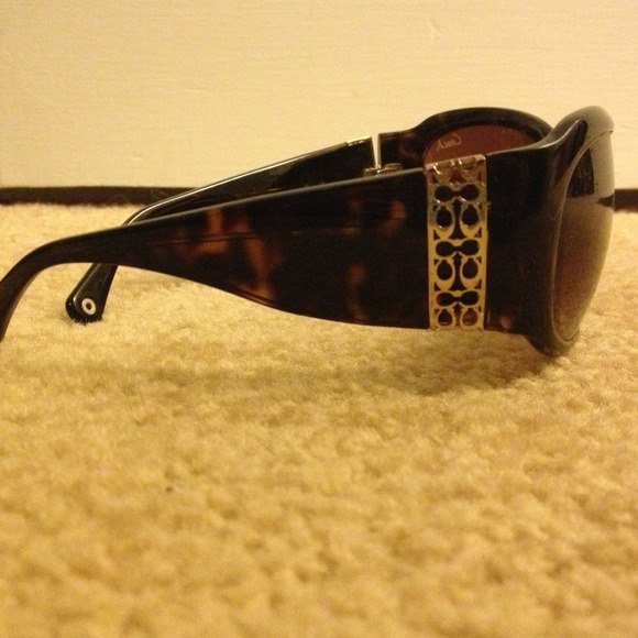 Coach sunglasses and case.