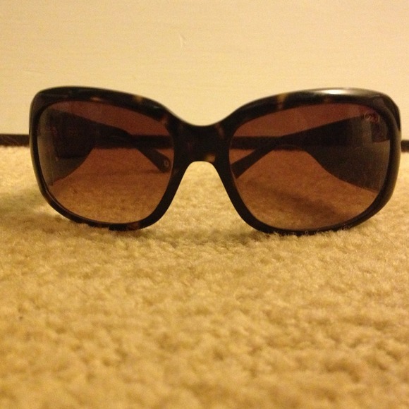 Coach sunglasses and case.