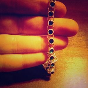 Tennis bracelet with green gemstones