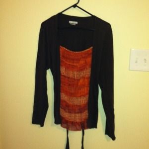 Ruffled shirt. Looks like 2 pieces, but it's not