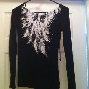 Black long sleeve shirt with white feathers