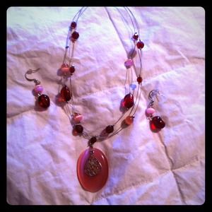 Pink beaded necklace and earring set together