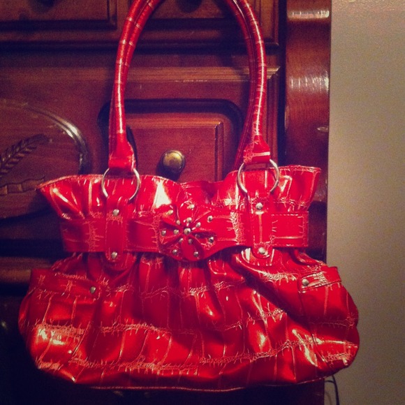 Red handbag with a flower design