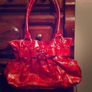 Red handbag with a flower design