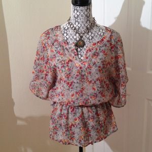 Floral batwing shirt.