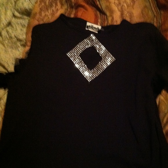A black top with middle and sleeves cut out(SOLD)