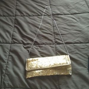 Gold sequined clutch.