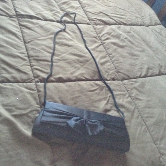 Black satin clutch with bow.