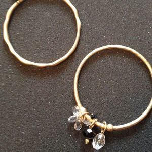 Two gold tone bangle bracelets