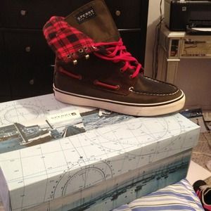 Brown and red sperry shoes
