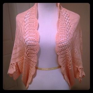 Crocheted peach colored shrug