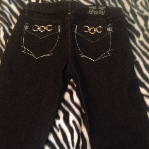 Dark blue/ black denim with buckle pockets