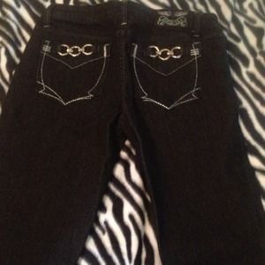 Dark blue/ black denim with buckle pockets