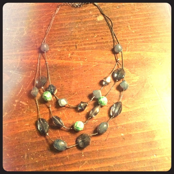 Three tiered green tone gem necklace