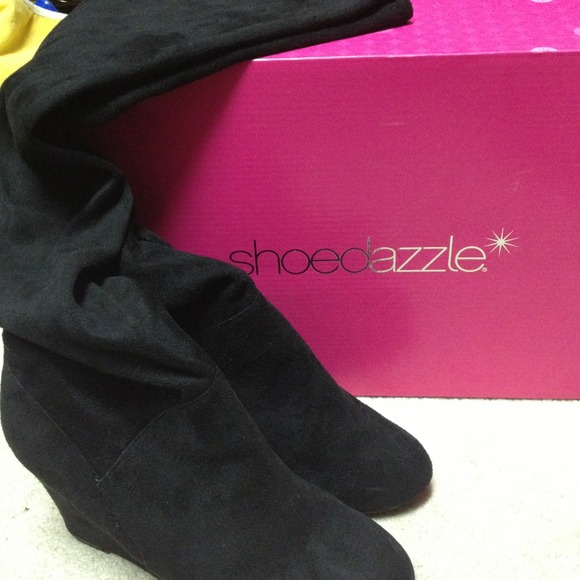 Black Suede thigh high wedge boots. Worn once.