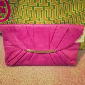 New with tags attached! Super cute pink clutch!