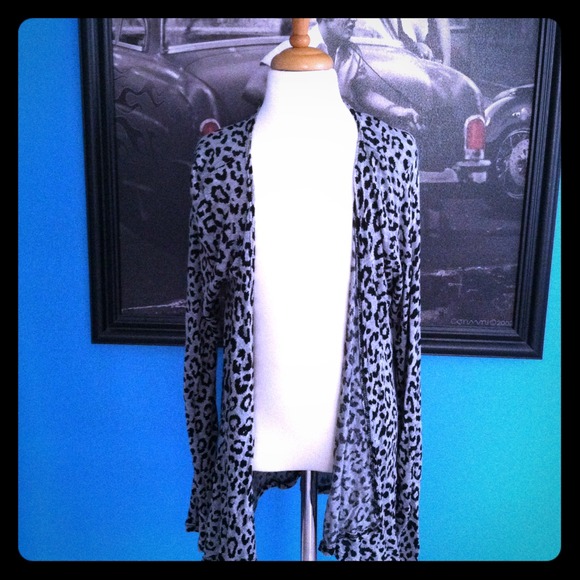 This cute cardigan is a Medium