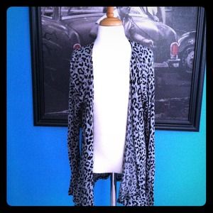 This cute cardigan is a Medium