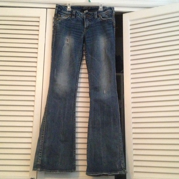 Silver slight flare distressed dark wash jeans!